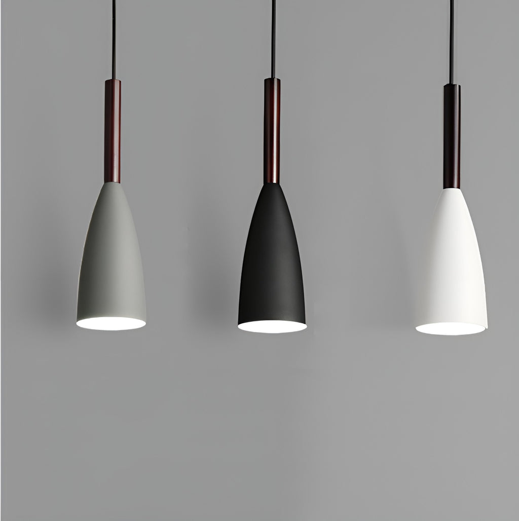 Three modern aluminum conical pendant lights in gray, black, and white with dark wood accents