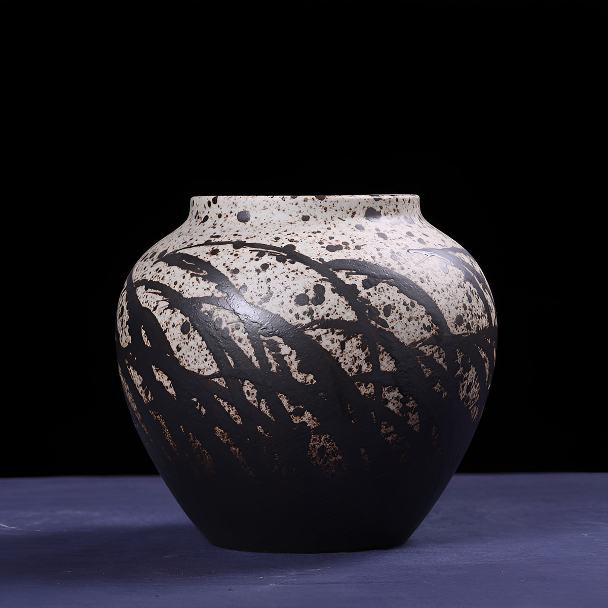 Handcrafted round monochrome glazed porcelain ceramic vase with painted leaf pattern